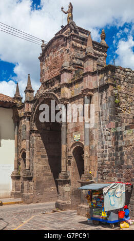 Street vendor selling drinks and snacks by the Arco Santa Clara in Cusco, Peru Stock Photo