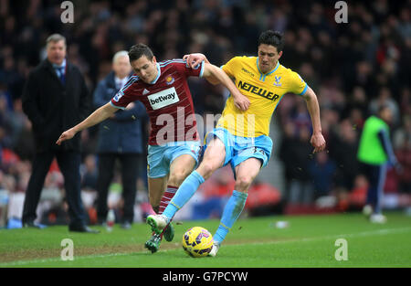 Crystal Palace's Martin Kelly (right) and West Ham United's Stewart Downing battle for the ball during the Barclays Premier League match at Upton Park, London. PRESS ASSOCIATION Photo. Picture date: Saturday February 28, 2015. See PA story SOCCER West Ham. Photo credit should read: Nick Potts/PA Wire.