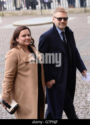 Kenneth Branagh and his wife Lindsay Brunnock arrive at Westminster Abbey in London for the memorial service of Lord Richard Attenborough, who died last year. Stock Photo