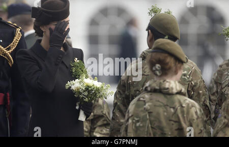 The Duchess of Cambridge meets veterans and cadets during a visit to the 1st Battalion Irish Guards at the St. Patrick's Day Parade at Mons Barracks, Aldershot, Hampshire, to mark St Patrick's Day today. Stock Photo