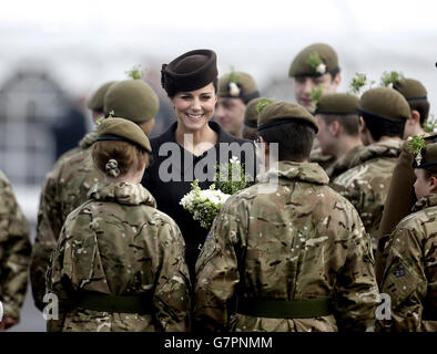 The Duchess of Cambridge meets veterans and cadets during a visit to the 1st Battalion Irish Guards at the St. Patrick's Day Parade at Mons Barracks, Aldershot, Hampshire, to mark St Patrick's Day today. Stock Photo