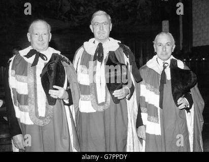 Lord Taylor (c) pictured with his sponsors, Lord Ogmore (l) and Lord Cohen of Birkenhead (r), at the House of Lords when he was introduced and took the oath as one of the new life peers. Lord Taylor was formerly Stephen Taylor, Socialist Member of Parliament for Barnet from 1945 to 1950. Today's was the second of the two special sittings of the Lords, held to enable the new life peers and peeresses to take their places for the State opening of Parliament. Stock Photo