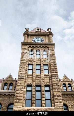 Calgary city hall with its lofty clock tower and sandstone facade. Stock Photo