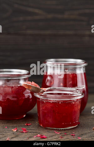 Rose petal jam on dark background Stock Photo