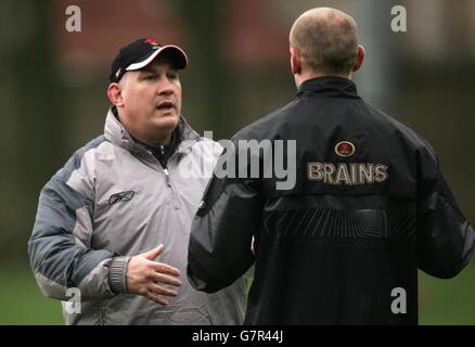 Wales coach Mike Ruddock (left) talks to his captain Gareth Thomas during training ahead of their opening match in the RBS 6 Nations Championship against England in Cardiff on Saturday. Stock Photo