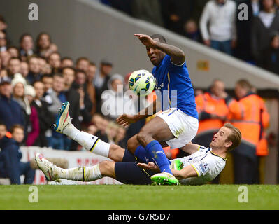 Tottenham Hotspur's Harry Kane (back) and Leicester City's Wes Morgan battle for the ball during the Barclays Premier League match at White Hart Lane, London. Stock Photo