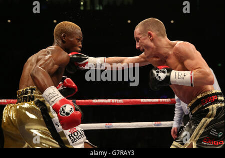 Paul Butler (right) in action with Zolani Tete in their IBF Super-Flyweight Championship of the World fight at the Echo Arena, Liverpool. Stock Photo