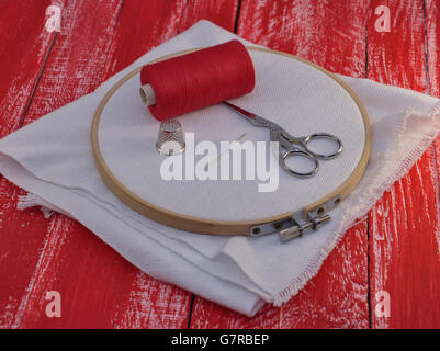Needle In Canvas With Red Thread For Embroidery Embroidery Macro Close Up  View From Above Free Copy Space Stock Photo - Download Image Now - iStock