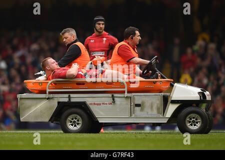 Wales' Samson Lee leaves the field on a stretcher during the RBS 6 Nations match at the Millennium Stadium, Cardiff. Stock Photo