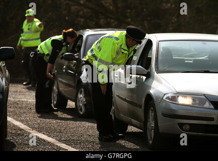 Police officers check vehicles at a roadside policing campaign Operation Westlock in Stirling, as Police Scotland Chief Constable Sir Stephen House visits the Driver and Vehicle Standards Agency (DVSA) vehicle inspection point at Craigforth. Stock Photo