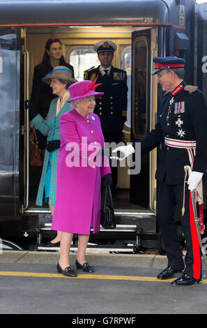 Queen Elizabeth II is greeted by Lord Lieutenant Sir Eric Dancer, as she arrives at Plymouth Railway Station, Devon, ahead of a visit to HMS Ocean, at HM Naval Base Devonport, in Plymouth, Devon. Stock Photo