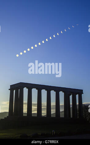 EDITORS NOTE: DIGITAL COMPOSITE IMAGE USING AN ND FILTER A digital composite photograph showing the eclipse of the sun over the National Monument of Scotland on Calton Hill in Edinburgh, as millions turned out to witness Britain enter the twilight zone of a near-total solar eclipse. Stock Photo