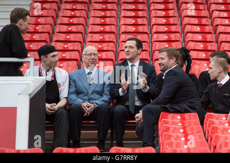 Chancellor of the Exchequer George Osborne (centre) and former England midfielder, Sir Bobby Charlton (second left) during a meeting with apprentices at Manchester United Football Club, in Trafford Park. Stock Photo