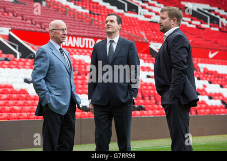 Chancellor of the Exchequer George Osborne (centre), former England midfielder, Sir Bobby Charlton (left) and Group Managing Director for Manchester United Richard Arnold, during a meeting with apprentices at Manchester United Football Club, in Trafford Park. Stock Photo