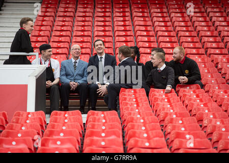 Chancellor of the Exchequer George Osborne (centre) and former England midfielder, Sir Bobby Charlton (second left) during a meeting with apprentices at Manchester United Football Club, in Trafford Park. Stock Photo