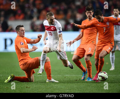 Soccer - UEFA Euro 2016 - Qualifying - Group A - Netherlands v Turkey - Amsterdam Arena. Netherland's Stefan de Vrij (left) and Ibrahim Afellay (right) stop Turkey's Caner Erkin (centre) Stock Photo