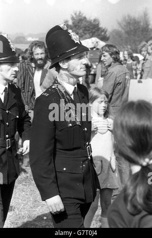 A policeman bears the stains of battle in Windsor Great Park, where there were scuffles with fans reluctant to leave the site of the free pop festival. Over 600 police had swooped on the festival and broke it up. Stock Photo