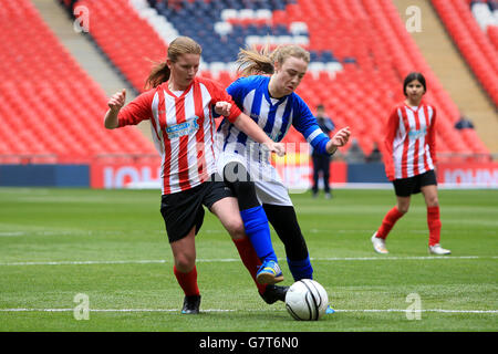 Match action between Elthorne High School representing Brentford and Northfield School & Sports College representing Hartlepool in the Kinder+Sport Football League Girls Cup final Stock Photo