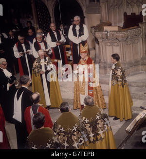 Dr. Donald Coggan, new Archbishop of Canterbury, Primate of All England, stands in front of the Archiepiscopal throne during his enthronement at Canterbury Cathedral. Stock Photo