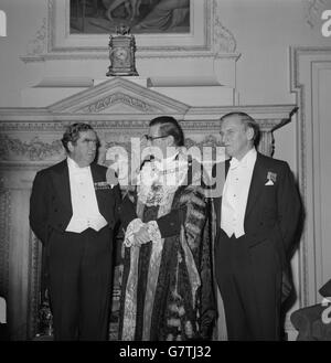 The Chancellor of the Exchequer Denis Healey (l) with the Lord Mayor of London Sir Murray Fox (c) and the Governor of the Bank of England Gordon Richardson at the Mansion House attending the Lord Mayor's dinner. Stock Photo