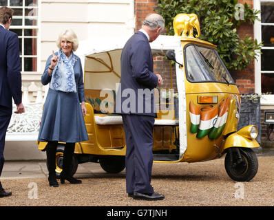 The Prince of Wales and Duchess of Cornwall during a reception to launch the 'Travels to My Elephant' Rickshaw Race at Clarence House in London. Stock Photo