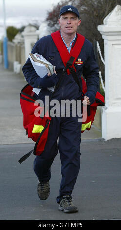 Postman Andrew Jamieson, who has been told that he could not do his rounds in Tynemouth accompanied by Oscar, his six month-old Bull Terrier. Andrew and Oscar had become a familiar sight for the village, however after one person complained, Royal Mail ordered Oscar to remain at home, citing Health and Safety reasons. Stock Photo