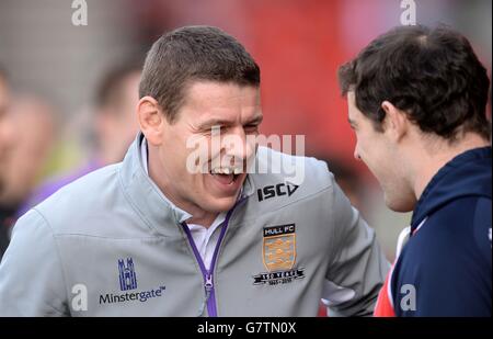 Hull FC head coach Lee Radford (left) talks with St Helens Paul Wellens (right) before the First Utility Super League match at Langtree Park, St Helens. Stock Photo