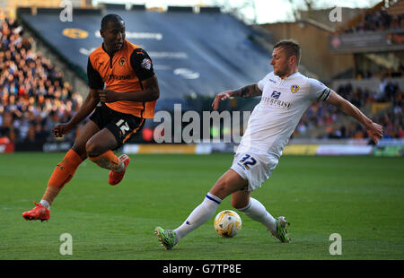 Wolverhampton Wanderers' Benik Afobe (left) and Leeds United's Liam Cooper (right) battle for the ball Stock Photo