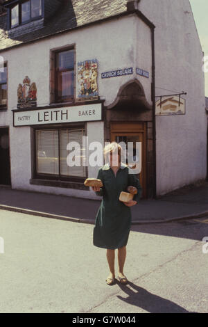 One of the workers at Leith bakery in Ballater, near the Royal Family's holiday home at Balmoral Castle, with 'By Royal Appointment', Royal Warrants on the front. Stock Photo