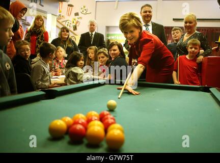 First Minister Nicola Sturgeon has a shot of pool during a visit to Loanhead after-school club and community nursery while on the General Election campaign trail. Stock Photo