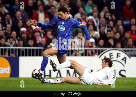 Real Madrid's Ivan Helguera and Juventus' Zlatan Ibrahimovic battle for the ball Stock Photo