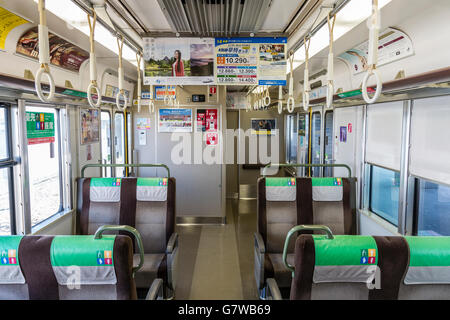 Japan, Ako. Japanese railway, JR, empty commuter train carriage, interior, seating and standing room. Stock Photo