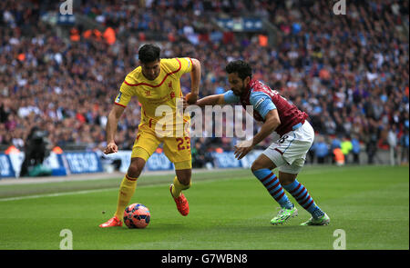 Liverpool's Emre Can (right) and Aston Villa's Fabian Delph (left) get ...