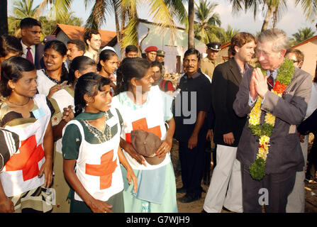 The Prince of Wales talks to local Red Cross girl workers, as he tours the destroyed village of Navallady on the Eastern coast of Sri Lanka, where the recent Tsunami devastated the region on 26th December last year, when he visited the village during a brief stop. The Prince will leave the island of Sri Lanka later today, to start an official tour of Australia, New Zealand and then Fiji, before returning home next month. Stock Photo