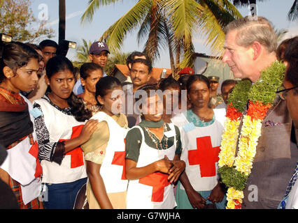 The Prince of Wales talks to local Red Cross girl workers, as he tours the destroyed village of Navallady on the Eastern coast of Sri Lanka, where the recent Tsunami devastated the region on 26th December last year, when he visited the village during a brief stop. The Prince will leave the island of Sri Lanka later today, to start an official tour of Australia, New Zealand and then Fiji, before returning home next month. Stock Photo