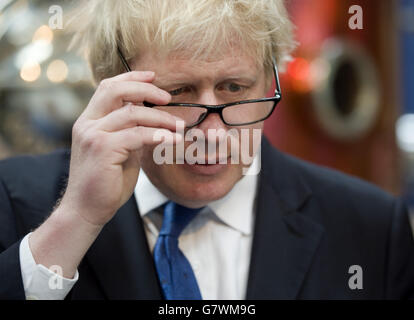 Mayor of London Boris Johnson visits Sipsmith's Gin distillery in Chiswick, London, the first copper distillery in the capital for 200 years. PRESS ASSOCIATION Photo. Picture date: Friday April 17, 2015. Mr Johnson has not ruled out becoming a minister in the first year of a Tory government but said David Cameron would not be in favour of such a move. Mr Johnson insisted he could not see how a ministerial position would be compatible with his job as Mayor of London, which will end in May 2016. After that the road would be clear for Mr Johnson to be promoted to government if the Tories form it Stock Photo