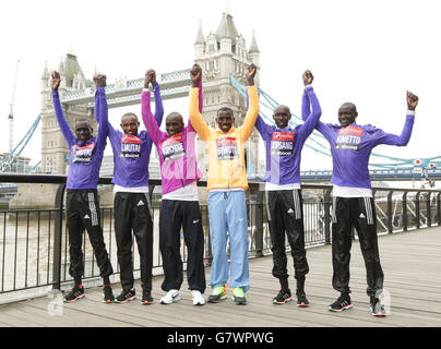 Elite runners (left to right) Emmanuel Mutai, Geoffrey Mutai, Eliud Kipchoge, Stanley Biwott, Wilson Kipsang and Dennis Kimetto during a photocall for the Elite Men's entries, ahead of the London Marathon, at Tower Hotel in London. Stock Photo