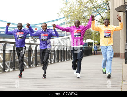 Elite runners (left to right) Emmanuel Mutai, Geoffrey Mutai, Eliud Kipchoge and Stanley Biwott during a photocall for the Elite Men's entries, ahead of the London Marathon, at Tower Hotel in London. Stock Photo