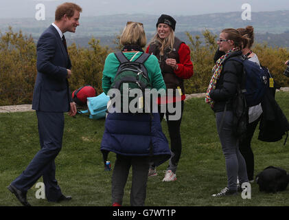 Prince Harry chats with a group of backpackers from New Zealand during a visit to The Nek, a narrow stretch of ridge in the Anzac battlefield on the Gallipoli Peninsula, as part of commemorations marking the 100th anniversary of the doomed Gallipoli campaign. Stock Photo