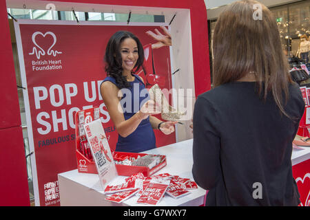 Television and radio presenter Sarah-Jane Crawford, helps set up the British Heart Foundation (BHF) pop-up shop at Westfield Stratford City, in east London. Stock Photo