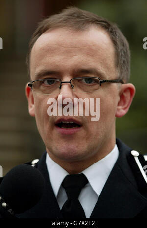 Surrey Police Assistant Chief Constable Mark Rowley reads a statement following the conviction of two of his former officers on charges of misuse of their public office. Andrew Lang and Mark Witcher were sentenced to 15 months. The pair were found not guilty however of raping a victim of crime after taking her home. Stock Photo