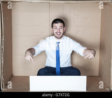 cheerful businessman points to the copy space Stock Photo