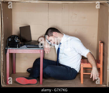 Tired businessman asleep in the office Stock Photo