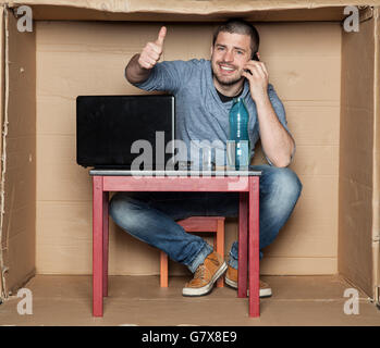 student talking on the phone working Stock Photo