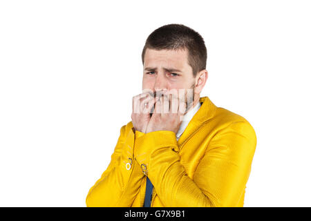 scared businessman chewing nails Stock Photo