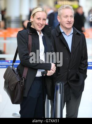 SNP's Mhairi Black MP the 20-year-old who ousted Labour frontbencher Douglas Alexander in the recent General Election arrives at Glasgow Airport with her father Alan as she joins other new SNP MPs as they travel to Westminster in London.