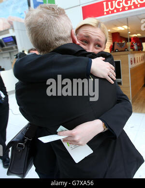 SNP's Mhairi Black MP the 20-year-old who ousted Labour frontbencher Douglas Alexander in the recent General Election arrives at Glasgow Airport with her father Alan as she joins other new SNP MPs as they travel to Westminster in London.