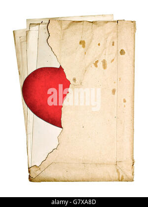 stack of old papers in a torn envelope isolated on white background Stock Photo