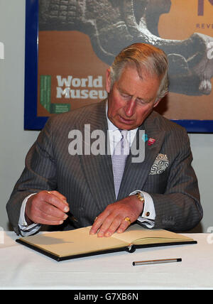 The Prince of Wales signs the visitors book as he arrives to look around the 'Mayas: revelation of an endless time' exhibition at the World Museum, celebrating a 'Year of Mexico in the United Kingdom' as part of his visit to Liverpool. Stock Photo