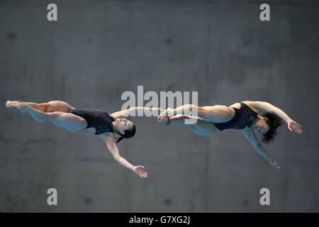 China's Minxia Wu and Tingmao Shi during the women's 3m synchro springboard final during the FINA Diving World Series at London Aquatics Centre. Stock Photo